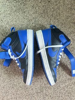 Blue and black nike shoes