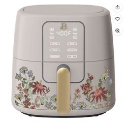The Beautiful 6 Qt Air Fryer by Drew Barrym features a unique design in Wildflower Porcini Taupe color with a TurboCrisp technology for air frying. Wi