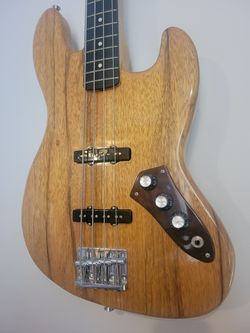 Custom black limba bass guitar