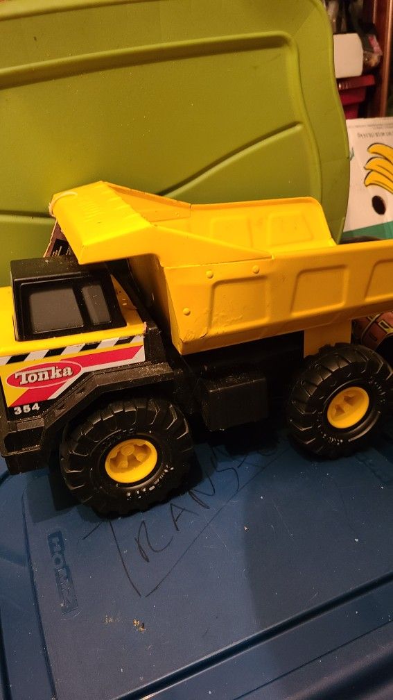 New tag Hasbro Tonka Steel Might Dump Truck 2012 yellow 16 1/2"  #930  item 90691 plastic wheels + under body.  Reg $55 + tax, now $38