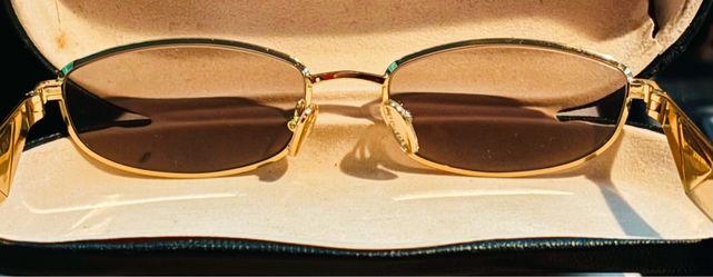 Prada Gold Frame Oval Sunglasses with Brown Lenses