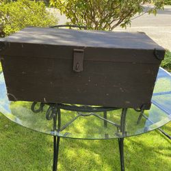 Vintage small wooden trunk with metal trim