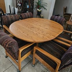 **Price Reduced.... Oak Table and Six Chairs On Casters 