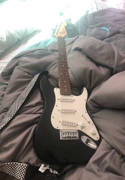 Squire medium sized electric guitar with case