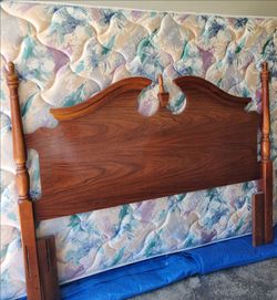 Queen Bed. Complete. Headboard and foot board, solid wood.  Comes with mattress and box spring.