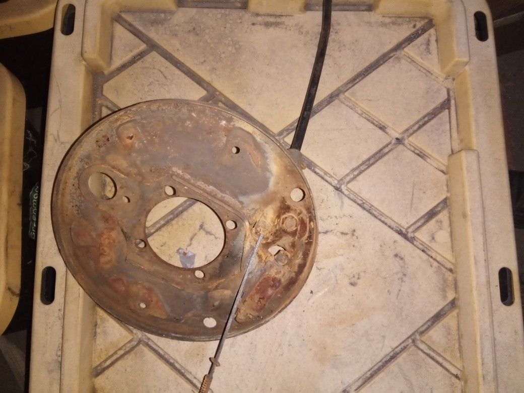 Vw beetle rear backing plate and emergency cable