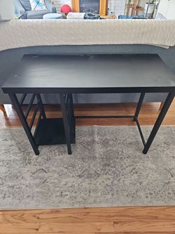 Black desk with storage area