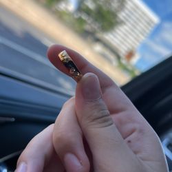 a Rose Gold Ring (name Aaron Engraved)