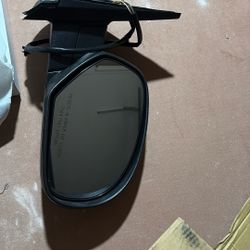 passenger-side (RH) power door mirror with the part number GM1321325. This part is a direct replacement for various GM vehicles from the late 2000s an