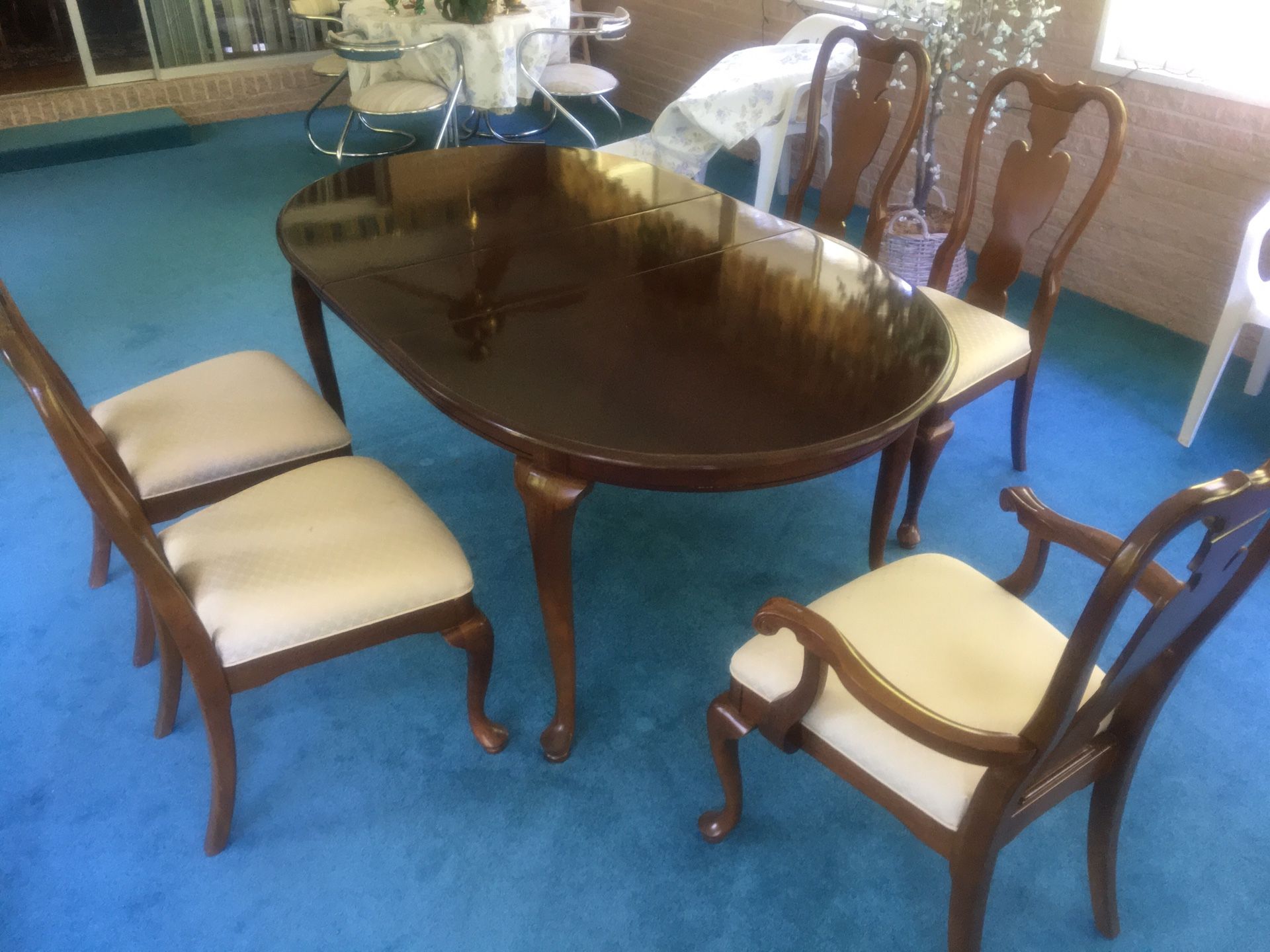 Dining table with five dining chairs