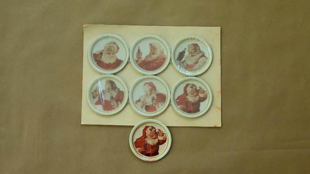 Set of 7 Vintage Tin Coca Cola Christmas Coasters Santa Drinking Bottle Of Coke
