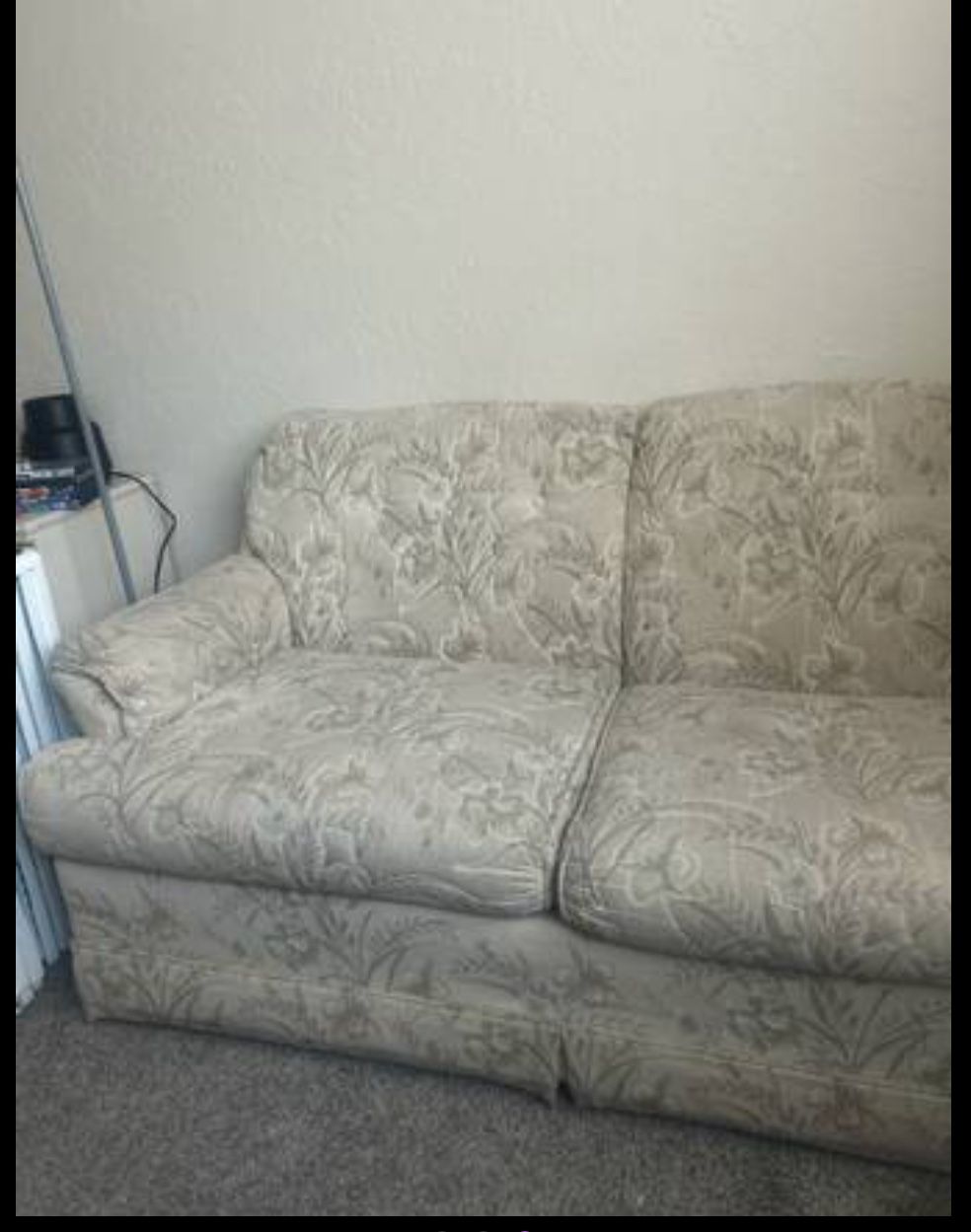 tan colored couch with flower design