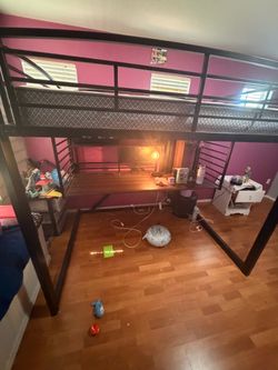 Bunked bed with desk and latter