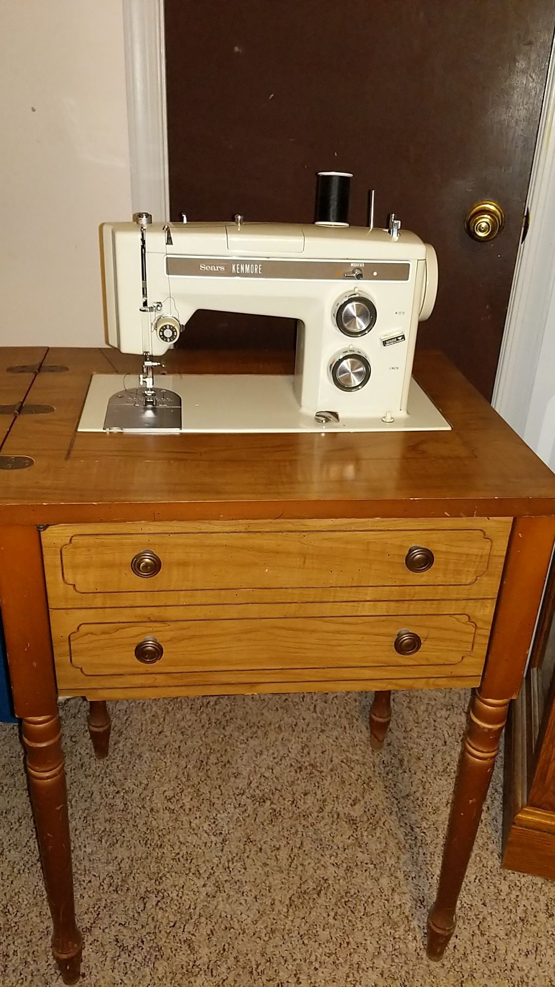 Sears kenmore sewing machine, with attachments.