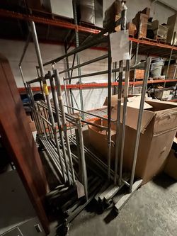 10 industrial rolling clothing racks.