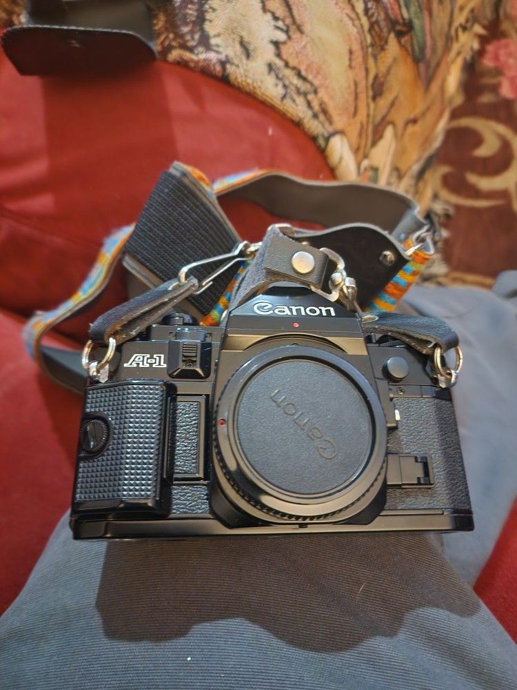 2 Cannon 35mm Cameras A1 And AE1, Lenses ,flashes And Bag