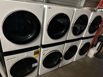LG stacked washer and dryer, new, white stainless steel and black stainless steel.