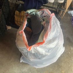 Bag full of clothes shoes 
