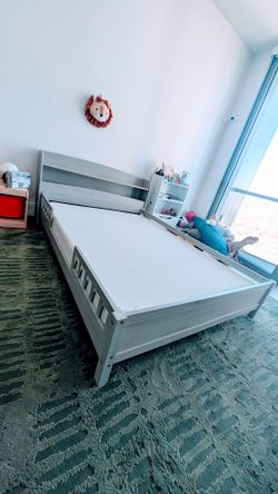 Full size kids bed with bookshelf headboard