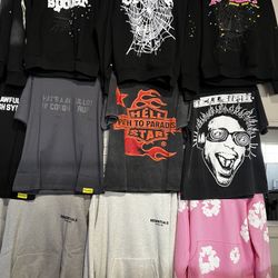 Belts And Black Shirt. Purple Jeans 