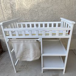 Changing table W/pullout Laundry Bin And Shelves