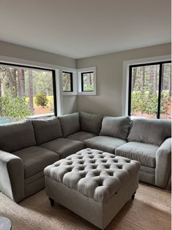 Full-sized Grey Sectional and Ottoman