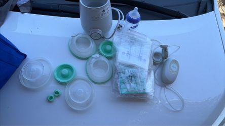 Elvie breast pump plus bottle warmer plus milk storage bags