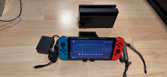 Nintendo switch oled with docking station, charger and wrist straps. No trades cash only. Check my other listings for more gaming stuff