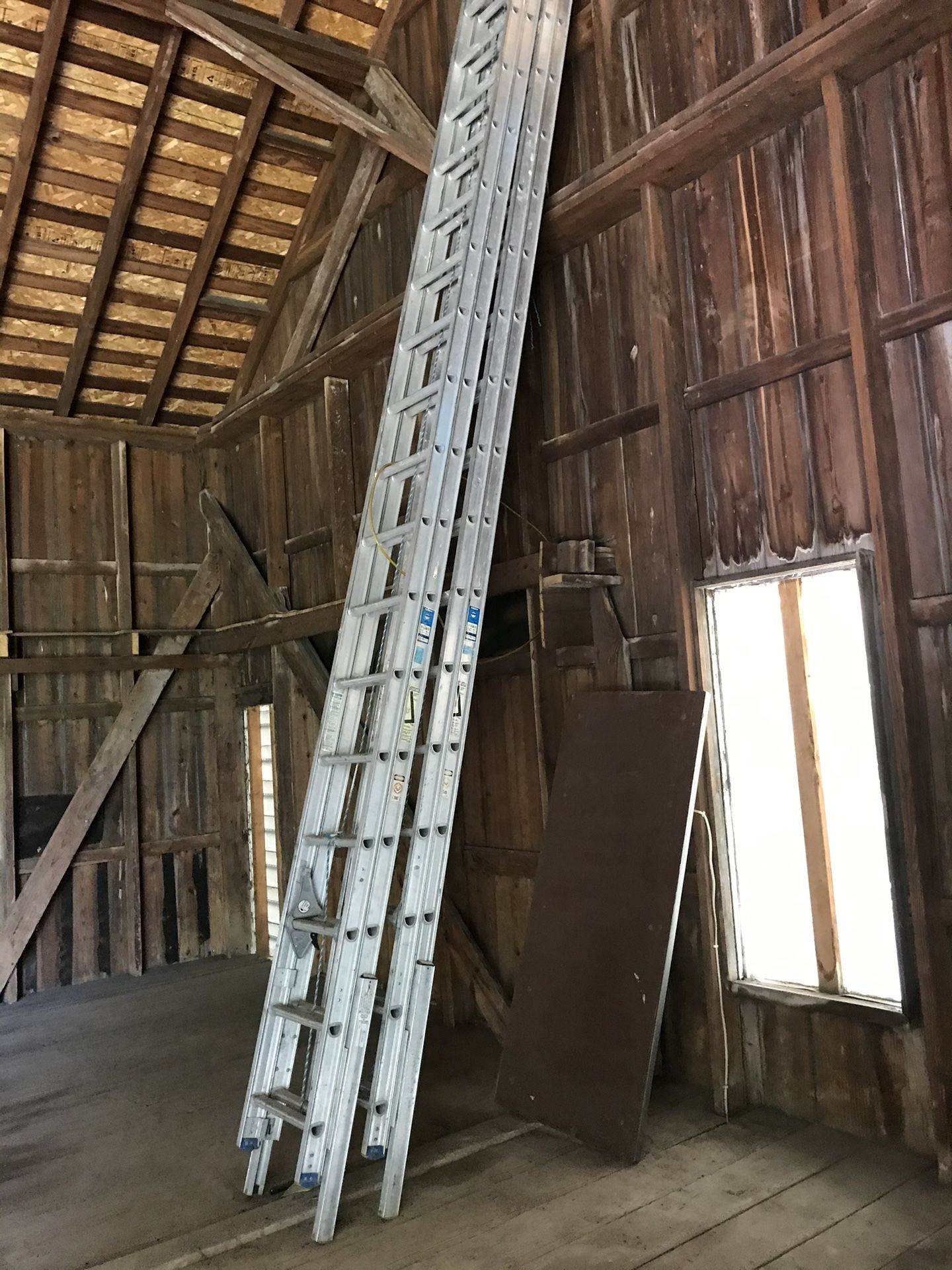 Two 36 Ft. Werner Self Leveling Extension Ladders