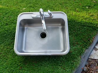 Stainless Steel Sink With Moan Faucet And Spray Set.