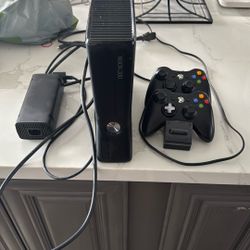 Xbox 360 With Power Cords And HDMI Cord. With 2 Controllers.