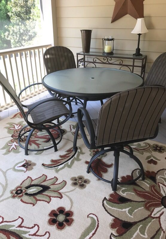 Patio furniture - chairs rock and swivel.