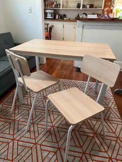 Light wood table and 4 chairs