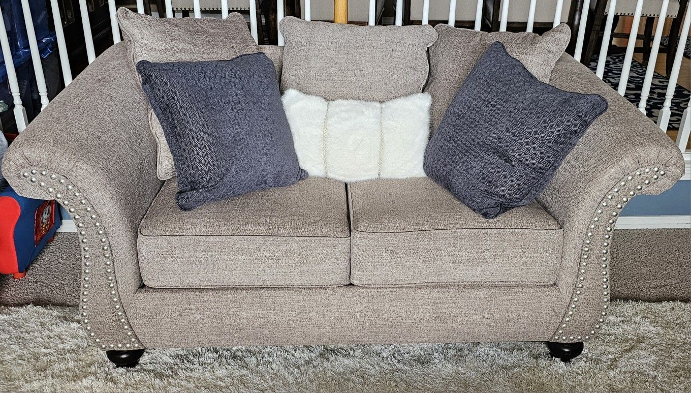 American Furniture Warehouse gray studded loveseat