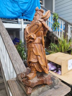 Chinese wood figurine about fifteen inches tall