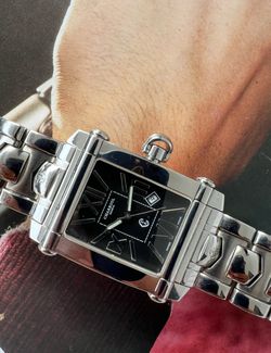 Charriol Colvmbvs (Columbus) reference CCSTRX9 is a luxury Swiss wristwatch featuring a rectangular stainless steel case, reliable quartz movement, an