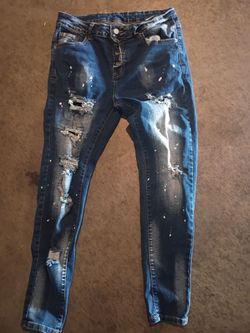Distressed Ripped Jeans with Paint Splatter