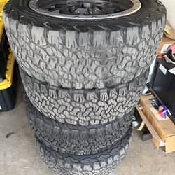 Black 20 inch rims with tires