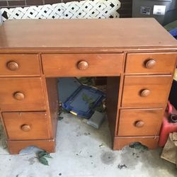 Desk- Library Style, Good Condition. 7 functional drawers. 30 inches high by 36 inches long by 19 inches in depth. 