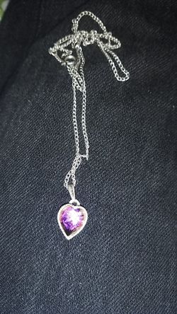 Woman's necklace with charm