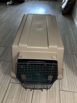 Petmate Dogloo / Vari Kennel style hard-sided plastic travel crate with a metal wire door and side vents