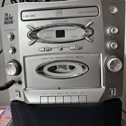 KARAOKE  MACHINE WITH MICROPHONE AND CDS