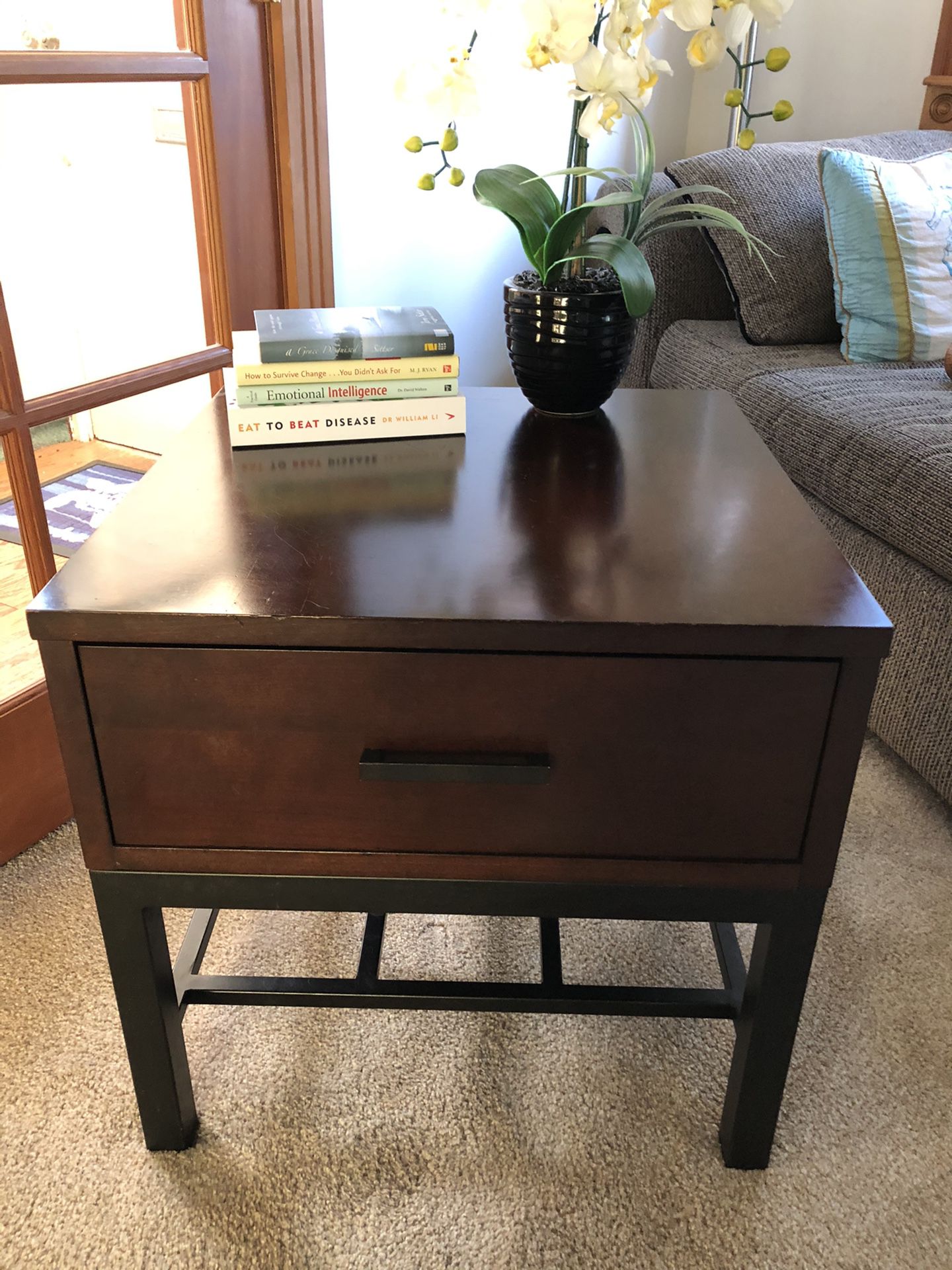 Two hardwood end tables, dark stain. Good shape and great drawers for storing things! Also a nice metal framework for storing and appeal.