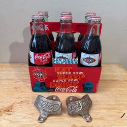 Coca-Cola six pack and two bottle openers