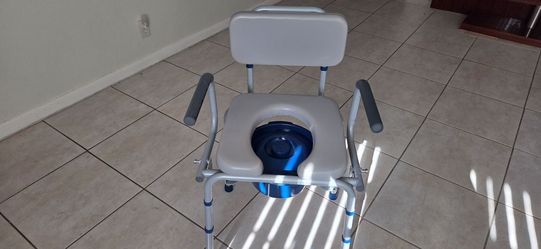 Bedside commode with pedded seats and removable arms