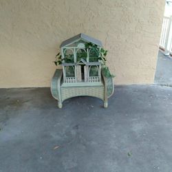 Bird House And Wicker Bench
