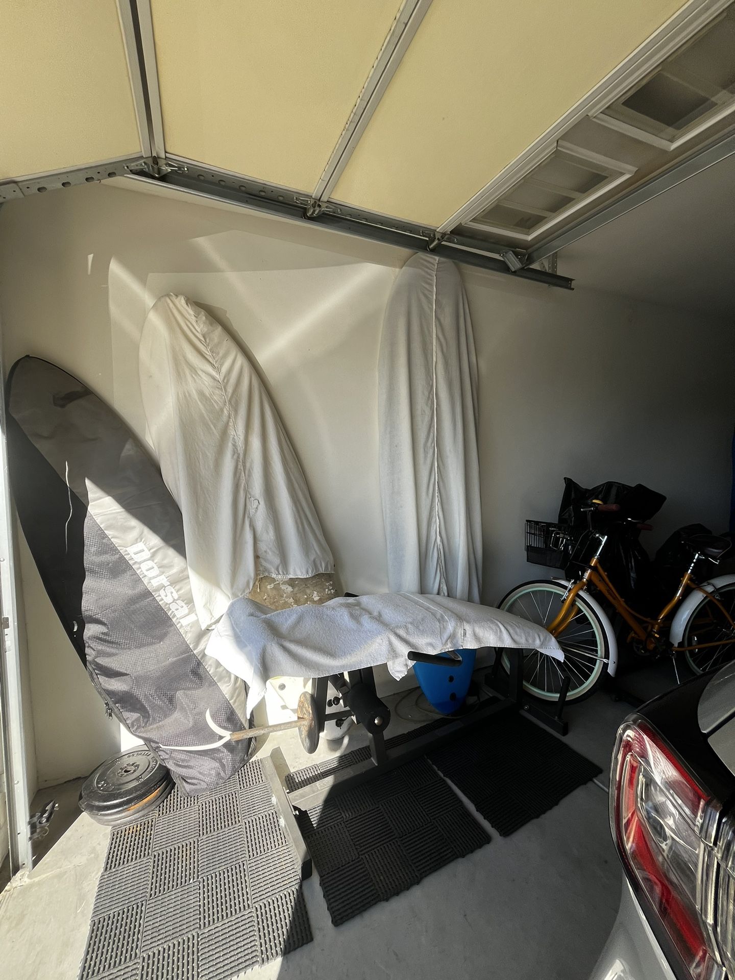 Two Foam Surf Boards One Is White and 6ft Tall And The Other Is Blue And 8ft Longboard