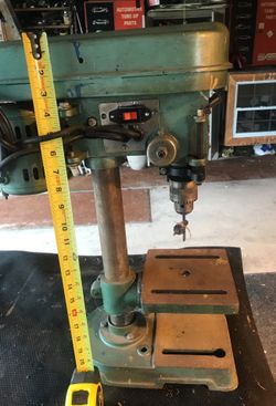 Small garage drill press works great probably adjust speech