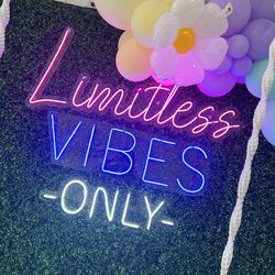 Neon Lights Sign $700 with grass wall