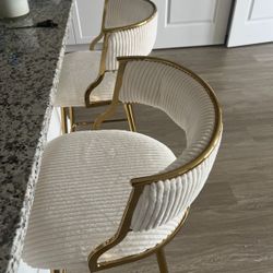 2 Bar Stools And A Couch 